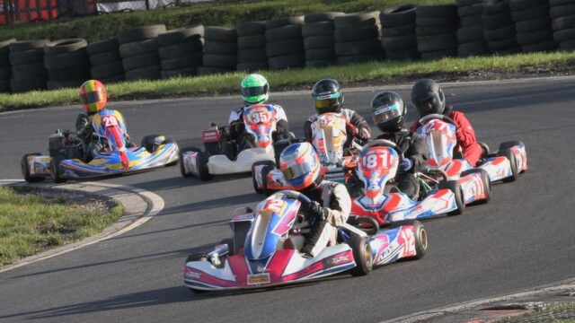 2 men riding go kart