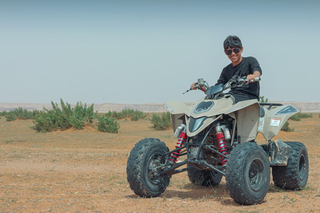 A man riding on the back of a four wheeler — 4 Wheel Drive Go-Karts