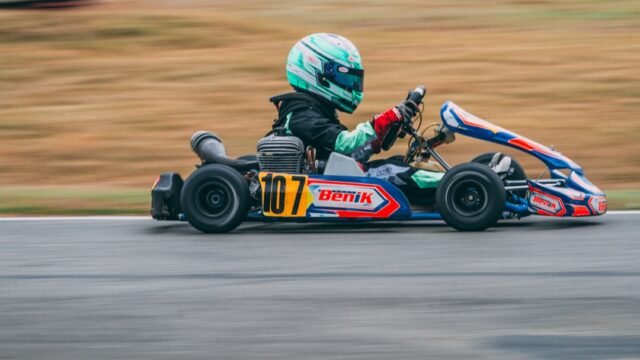 man riding on go kart