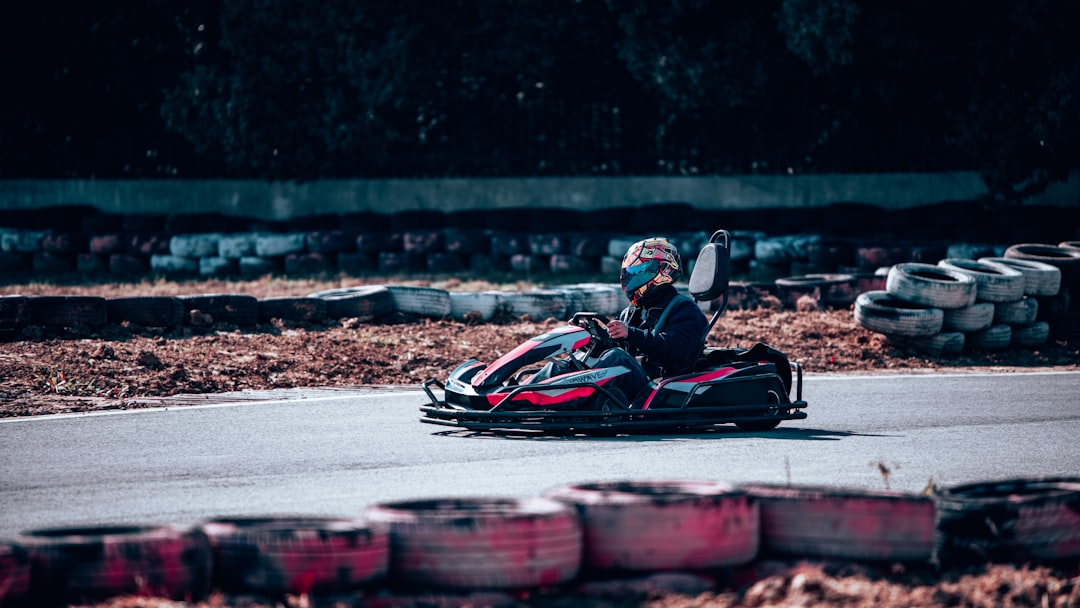 a person riding a go kart on a race track