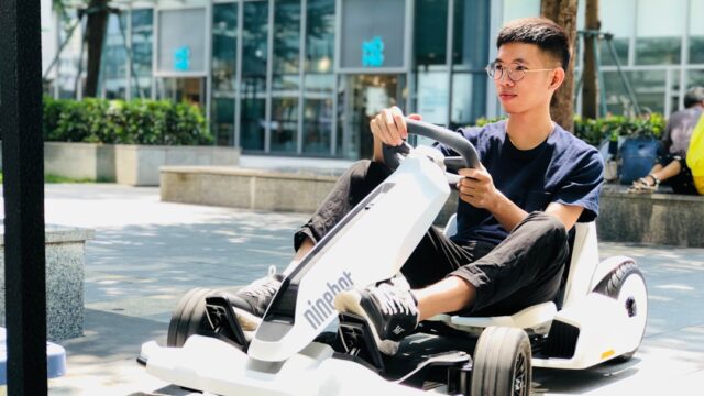 man riding on Segway Ninebot GoKart during daytime