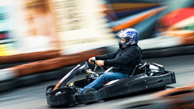 man riding on go kart