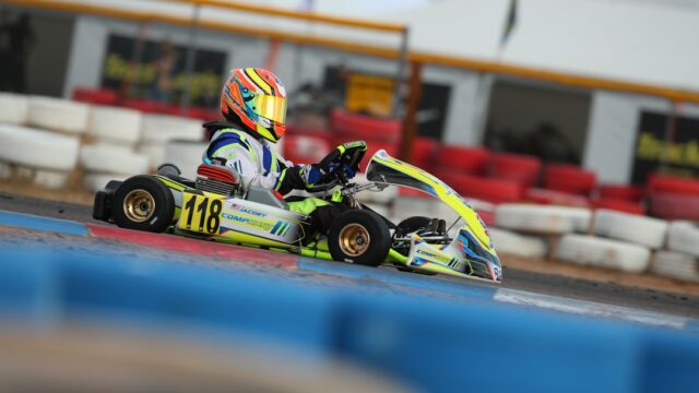 man riding on go kart