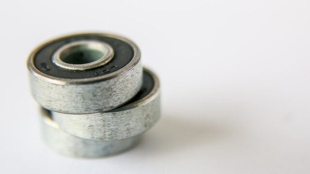 Silver and gold round coins — Go-Kart Axle Bearing
