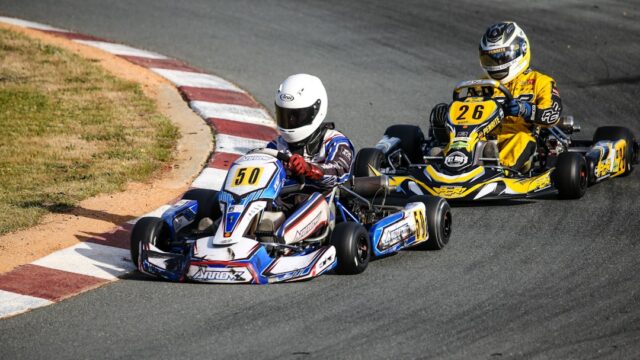 two kart racers swerving at the race track