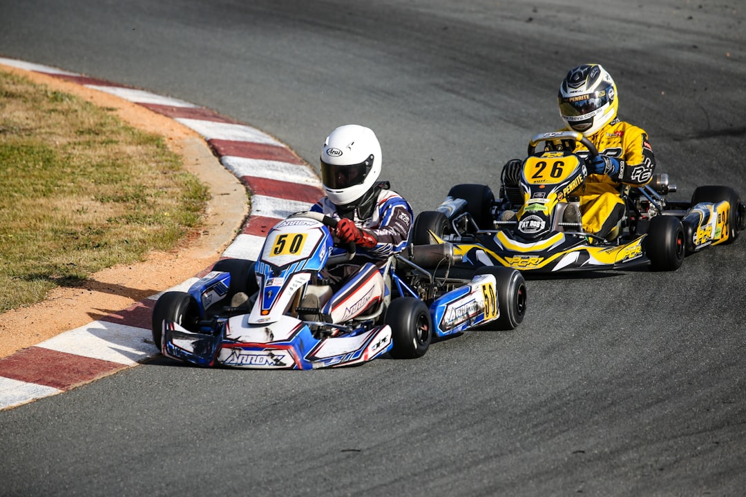 Two kart racers swerving at the race track — Go-Kart Steering