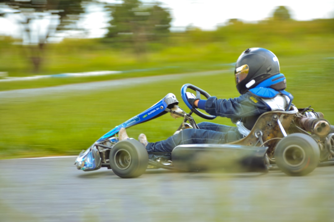 a person riding a go kart on a road
