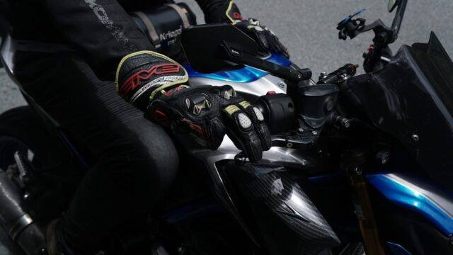 Rider wearing gloves on a motorcycle