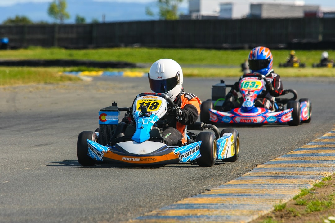 Two go-kart drivers on race track — Kids’ Go-Kart Kits