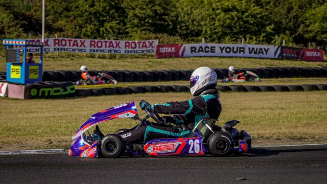 Go-kart racer on track with colorful vehicle