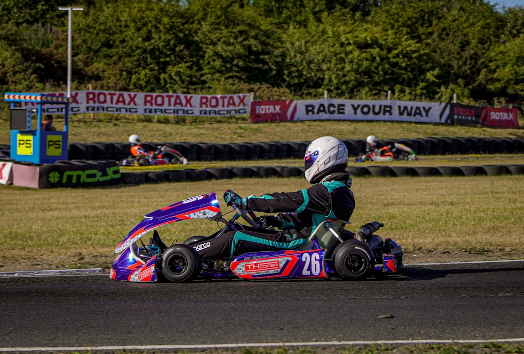 Go-kart racer on track with colorful vehicle