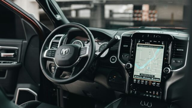Black car gps turned on in car — Best Go Kart Steering Wheel