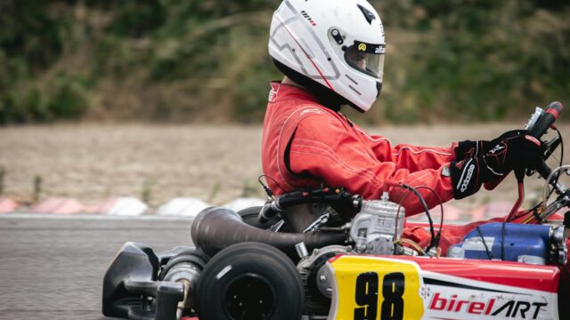 a person driving a go kart