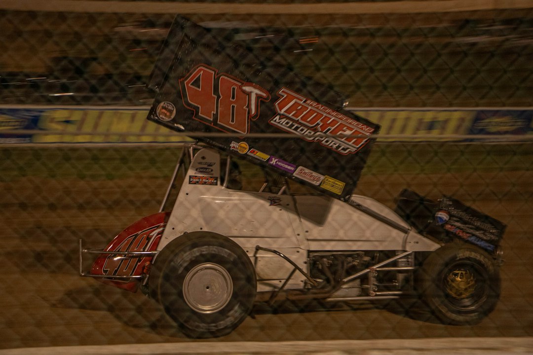 Sprint car racing on a dirt track at night — Electric Shifter Kart