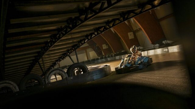 a person riding a go kart on a track