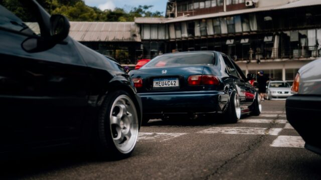 a couple of cars that are sitting in the street