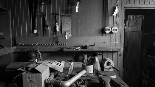 A cluttered workbench with tools and supplies — Racing Go-Kart Clutch