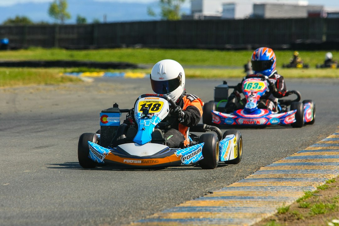Two go-kart drivers on race track — Small Electric Go-Kart
